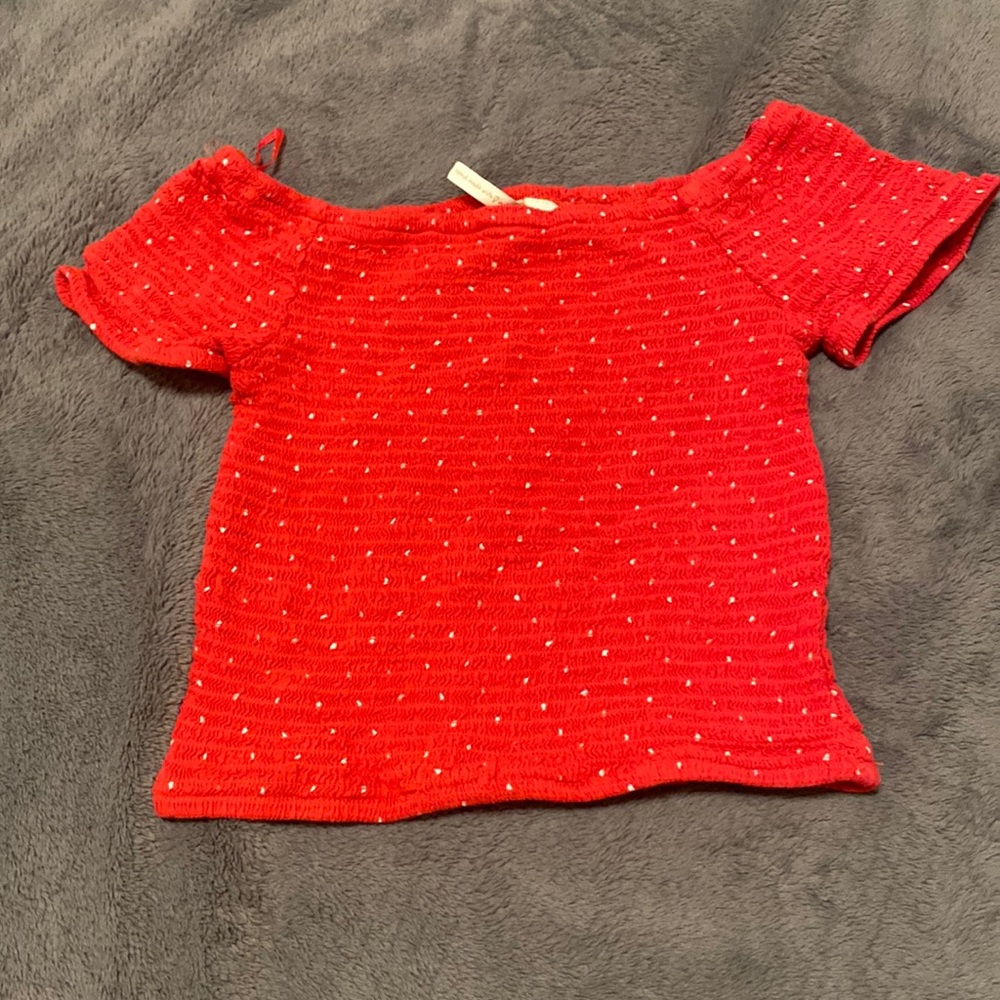 tightly fitted red and white cropped top